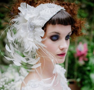 Beaded and feathered skullcap white bridal headpiece